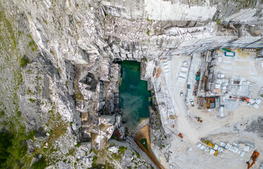 Aerial view of the blue lake of the marble quarry Valsora Massa Carrara Tuscany Italy