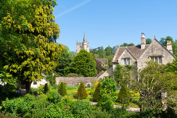 View of village and church Castle Combe Wiltshire England UK