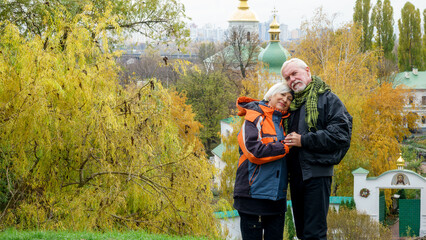 Elderly gray-haired optimistic couple