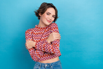 Photo of lovely girly lady wear pink shirt embracing herself empty space isolated blue color background