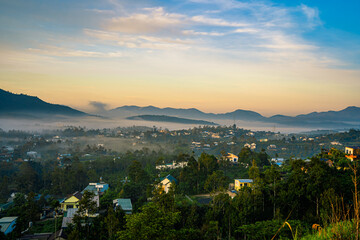 Mountains during dawn. Beautiful natural landscape in the summer time with fog