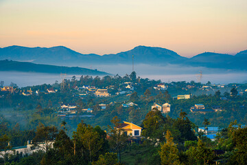 Mountains during dawn. Beautiful natural landscape in the summer time with fog