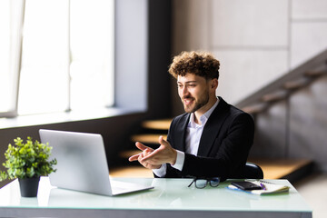 Businessman participate at virtual distant negotiations with colleagues via teleconference.