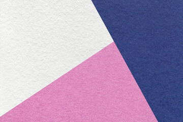 Fototapeta premium Texture of craft white, lilac and navy blue shade color paper background, macro. Vintage abstract purple cardboard