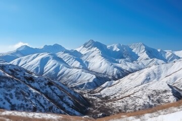 Fototapeta premium majestic mountain landscape with snow-covered peaks and blue sky, created with generative ai