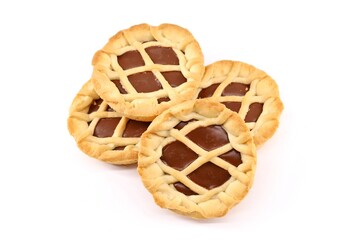 Group of small chocolate tarts on white background