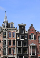Fototapeta na wymiar Amsterdam Oudezijds Voorburgwal Canal Historic House Facades, Netherlands