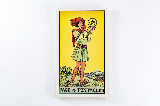 Madrid, Spain - May 22, 2023: Tarot cards, Rider Waite tarot cards, the page of pentacles vintage card in the foreground.