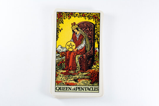 Madrid, Spain - May 22, 2023: Tarot cards, Rider Waite tarot cards, the queen of pentacles vintage card in the foreground.