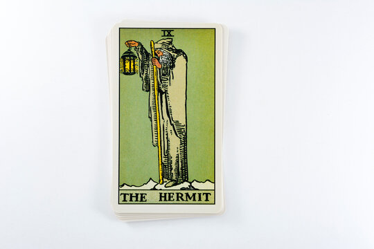 Madrid, Spain - May 22, 2023: Tarot cards, Rider Waite tarot cards, the hermit vintage card in the foreground.