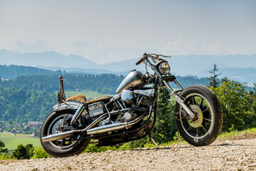 Fototapeta na wymiar a classic chopper motorbike in the swiss countryside