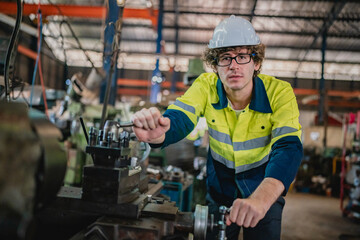 Production engineers are assisting adjusting and maintaining factory machine, Male workers technician examining control the industrial technology tool, professional repair men work in industry plant