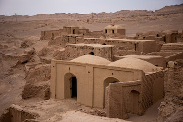 ancient medieval ruins of a city from clay and mud in iran desert house with half dome roof