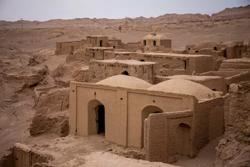 Papier Peint photo autocollant Half Dome ancient medieval ruins of a city from clay and mud in iran desert house with half dome roof