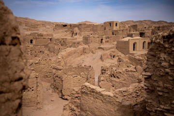 ancient medieval ruins of a city from clay and mud in iran desert