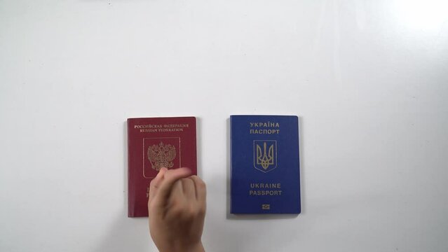 A person is faced with the choice of citizenship, being presented with passports