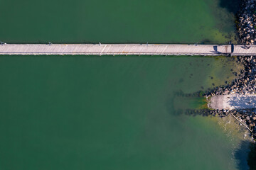 Wooden pier along a rocky coastline