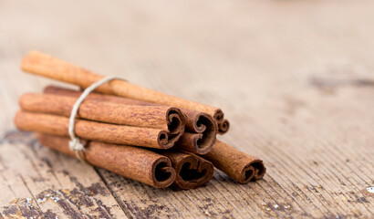 Cinnamon sticks on Wooden Background