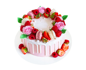 Birthday sweet cake with berries, macaron and floral decor isolated on a white background.
