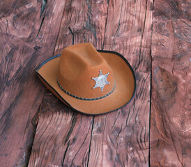 cowboy sheriff hat on wooden background