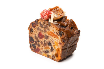 A cake with dried fruits, raisins almonds, dried strawberry.