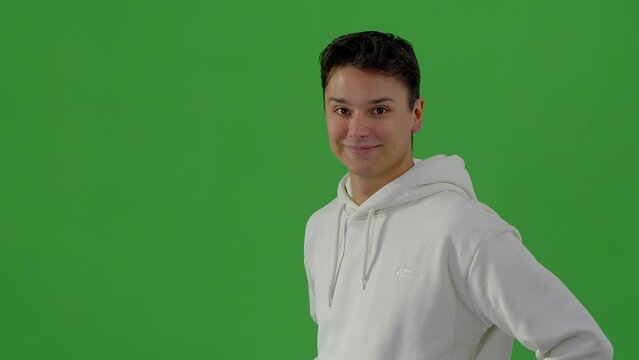 Portrait shot of a handsome young man in a green screen studio - people photography