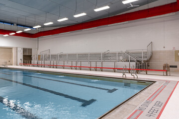 Public interior swimming pool / natatorium with tile lane lines.	