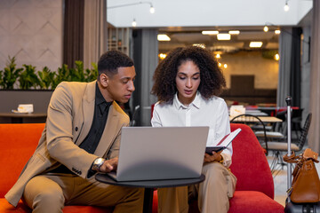 Business partners discussing new project and looking involved