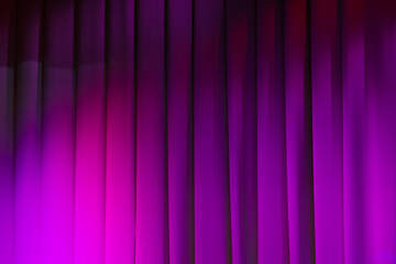 Wavy theatrical curtain with purple spot lights illumination