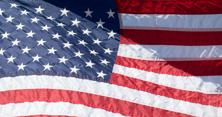 Fototapeta premium An American Flag waves in the breeze