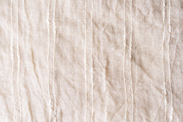 Fototapeta na wymiar Beige cotton fabric with stripes. Texture, background