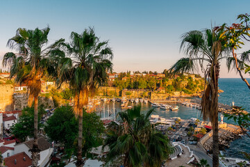 Fototapeta premium View from a height of the harbor near the old town of Kaleichi in the Turkish city of Antalya. Old port in Antalya with many ships and boats. Popular tourist place in Anatalya.