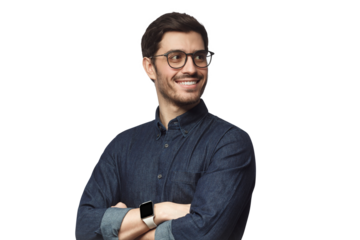 Confident young businessman looking away, standing with crossed arms