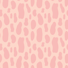 Abstract seamless pattern of pink spots on bright pink background, oval-shaped and different in sizes