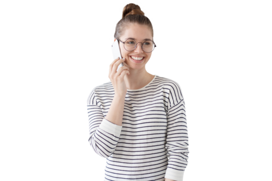 Happy female student wearing glasses, talking on the phone with cheerful smile