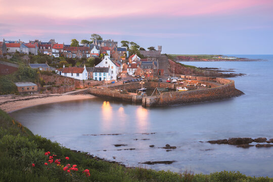Scenic, picturesque sunset view of the charming coastal fishing village of Crail and its harbour in East Neuk, Fife, Scotland, UK.