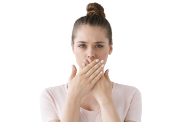 Young woman keeping secret, covering mouth with hands