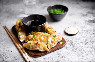 Dumplings with soy sauce in a plate