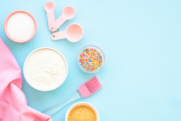 Food baking background. Ingredients for cooking at blue. Flat lay.