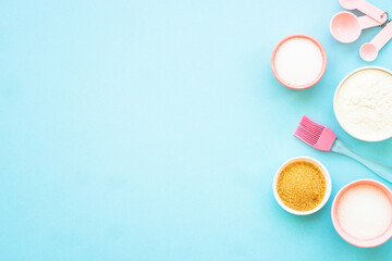 Food baking background. Ingredients for cooking at blue. Flat lay.