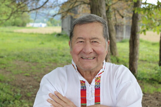 Indigenous elder person posing with joy 