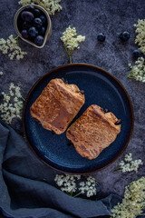 Freshly baked pain au chocolate on dark background