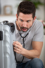 Fototapeta na wymiar a man using a suitcase