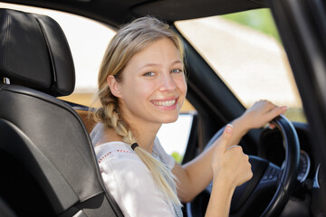 a woman showing thumb up