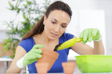 mid section of person cutting herbs