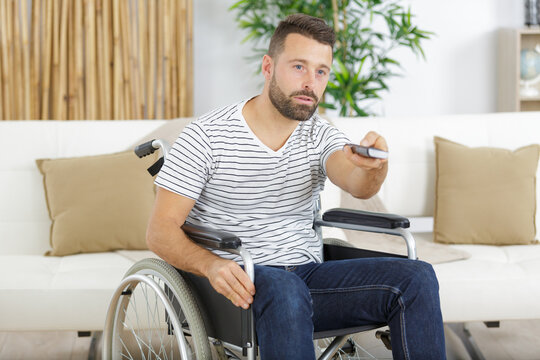 disabled man watching sports on tv