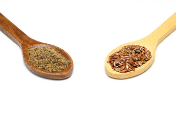 Flax seeds. Flaxseed powder in a wooden spoon. Standing on a white background.