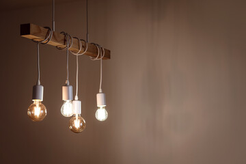 Glowing light bulbs in dark room