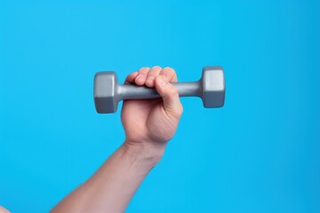 Hand holding gym dumbbell on blue background, Generative AI
