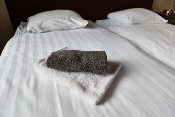 Hotel bed with white sheets